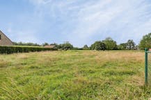 Bouwgrond (1.297m²) te koop voor halfopen bebouwing te Sijsele (Damme)