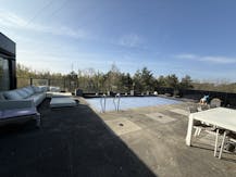 Patrimoniumvennootschap met drie bedrijfshallen en penthouse