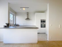 Appartement met ZW-tuin en autostaanplaats te huur in Wilrijk 