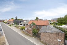 Twee aanpalende bouwgronden (nr. 55 & 57) – samen 933 m²