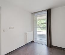Appartement moderne au rez-de-chaussée avec terrasse ensoleillée et place de parking !