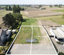Lot bouwgrond (697 m²) + alleenstaande woning te koop Hulste