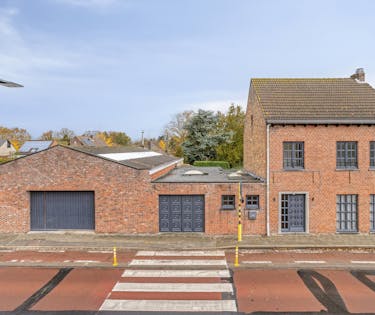 Huis (2slpk) met garage en loods (170m²)