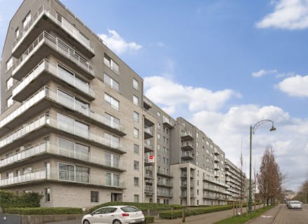 Appartement récent 2 chambres à vendre à Molenbeek avec parking et cave