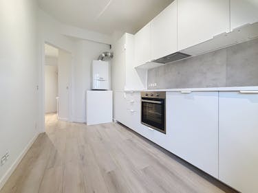 Appartement met 2 kamers, tuin en garage in Strombeek-Bever