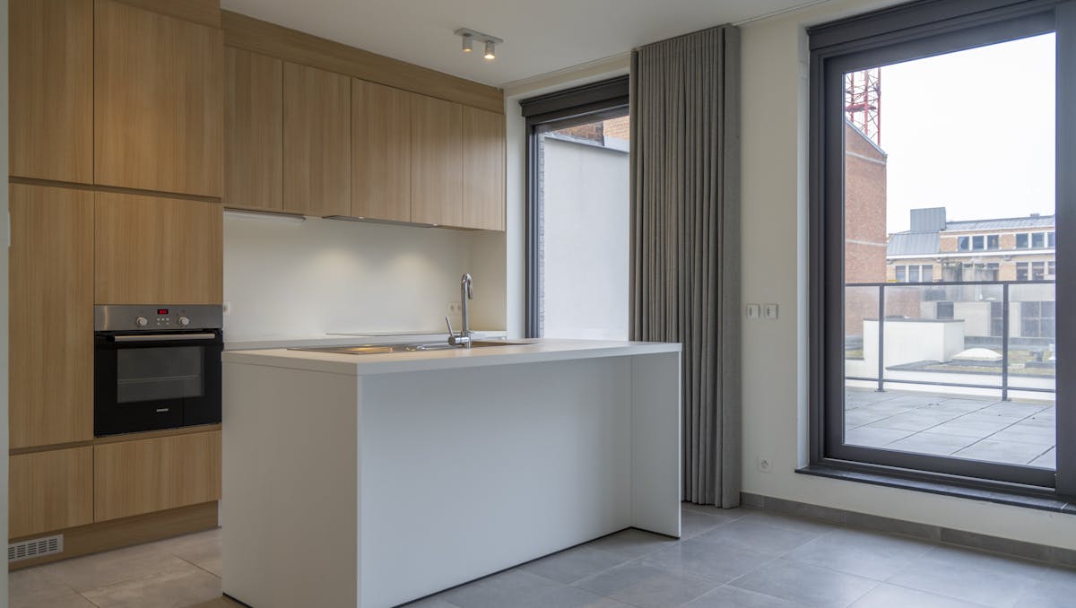 Wonen op twee niveaus in hartje Kortrijk.