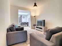 Instapklare rijwoning te koop met gezellige stadstuin 