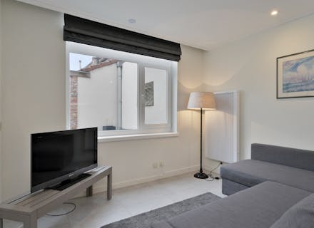 Gerenoveerde studio met slaapkamer en ruim terras te koop op een toplocatie in Brugge centrum