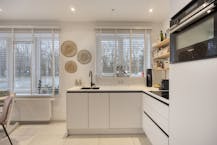 Gelijkvloers appartement met prachtige zuid-tuin en garage