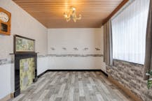 Te renoveren woning met zonnige tuin in Genk