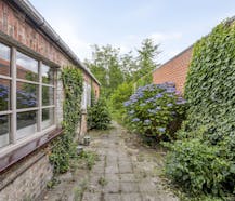 Halfopen woning met zonnige tuin op toplocatie in Sint-Michiels
