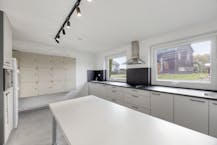 Opbrengsteigendom met 9 studentenkamers en duplex-appartement te Hasselt